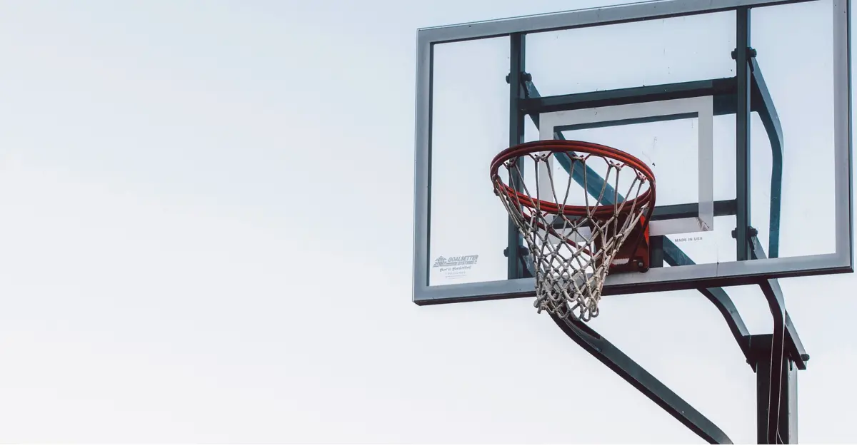 a picture contains a basketball hoop attached to a backboard that frequently needs maintenance