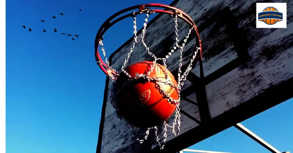 A basketball hoop which is made up of chain net and stiff backboard